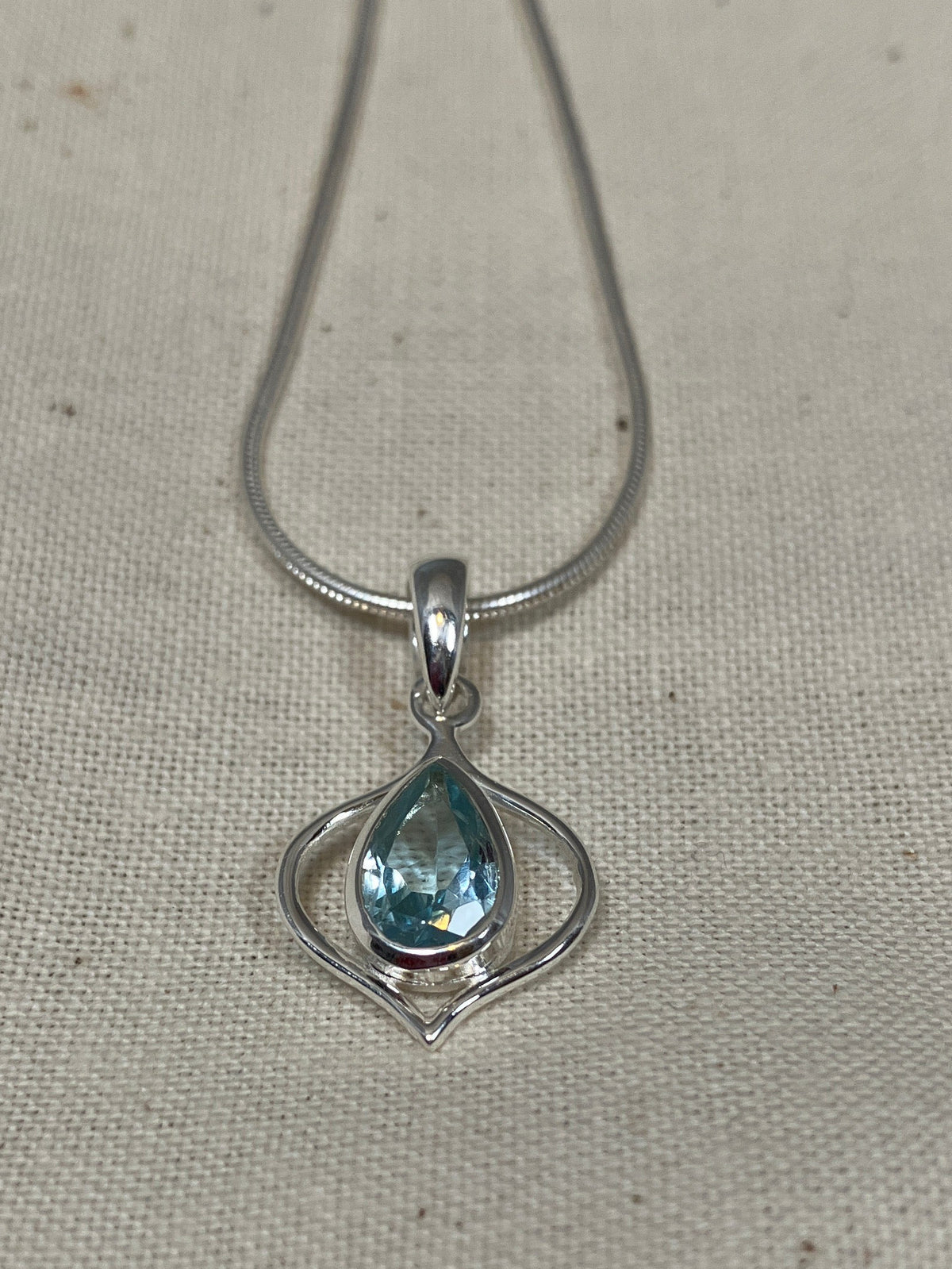 Blue Topaz In Pointy Frame Pendant