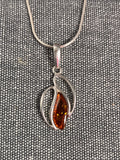 Swimming Seeds Amber Pendant