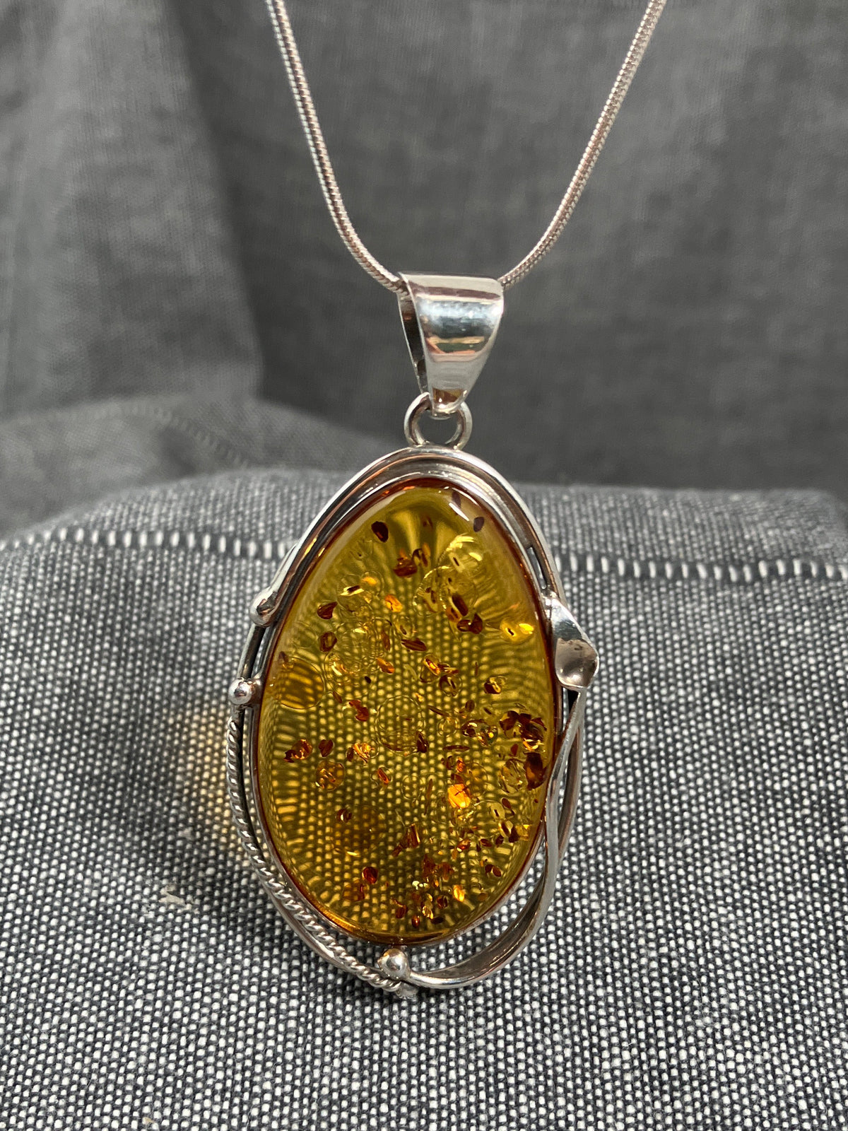 Amber Swirl Frame Oval Pendant
