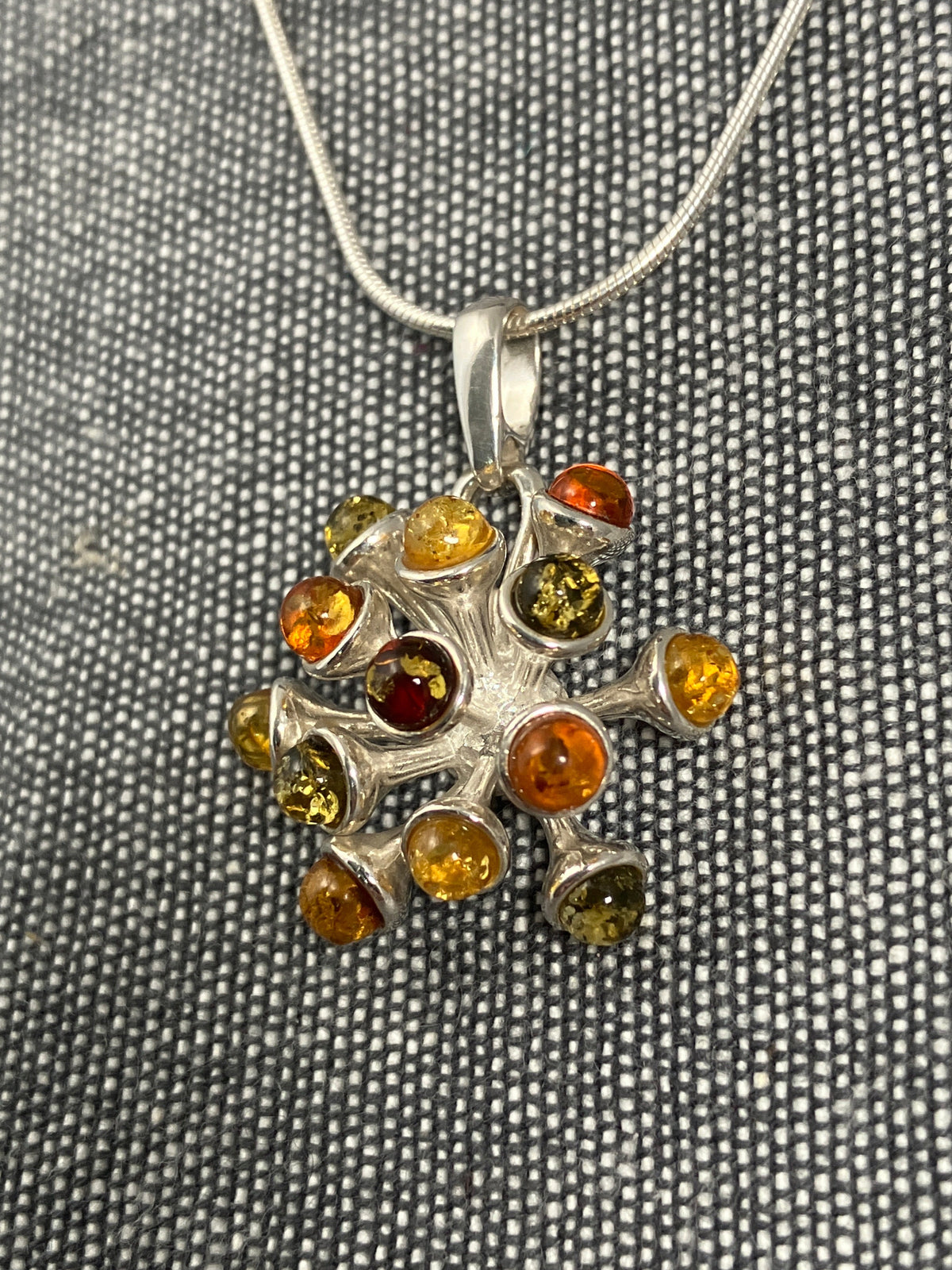 Multicoloured Amber Seed Explosion Pendant