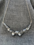 Out Of Line Black Wave Necklace
