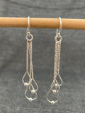 Swinging Ball In Loops Earrings