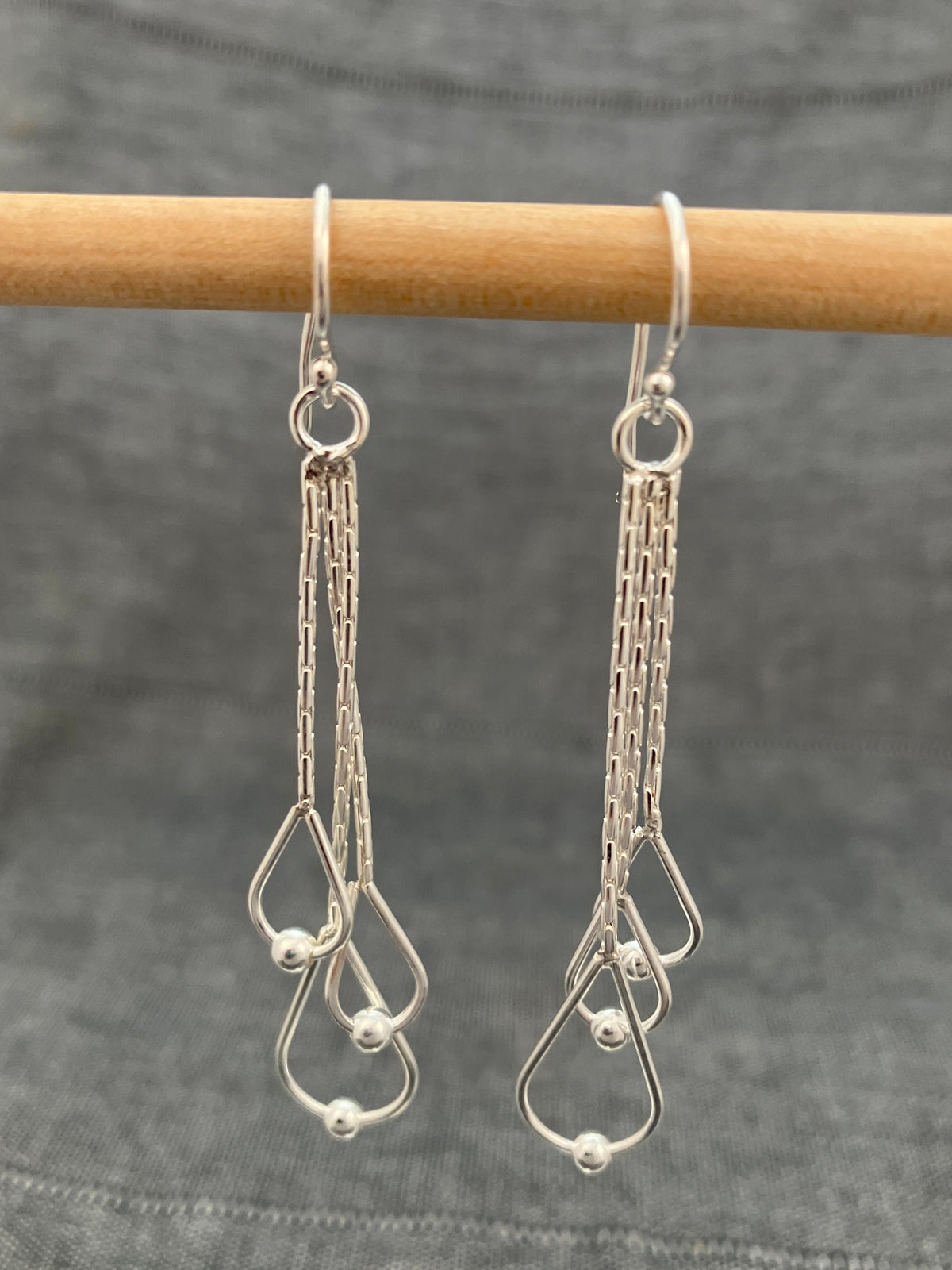 Swinging Ball In Loops Earrings