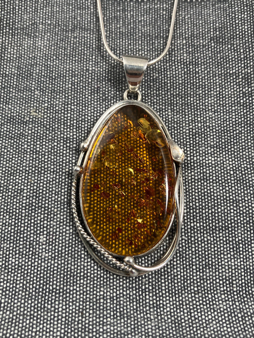 Amber Swirl Frame Oval Pendant